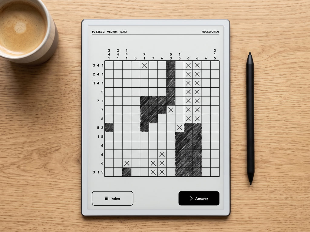 A medium nonogram in progress on an e-ink tablet beside a coffee and stylus